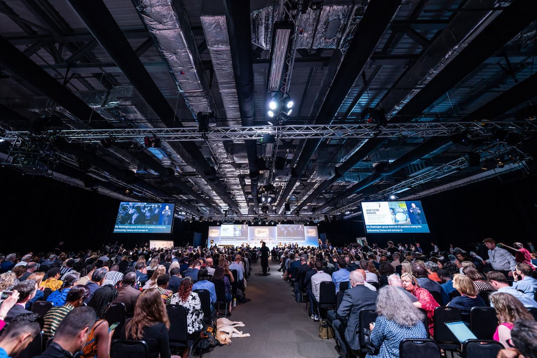 A photo of the GDS Summit in London in 2018, depicting people seated during one of the main sessions.